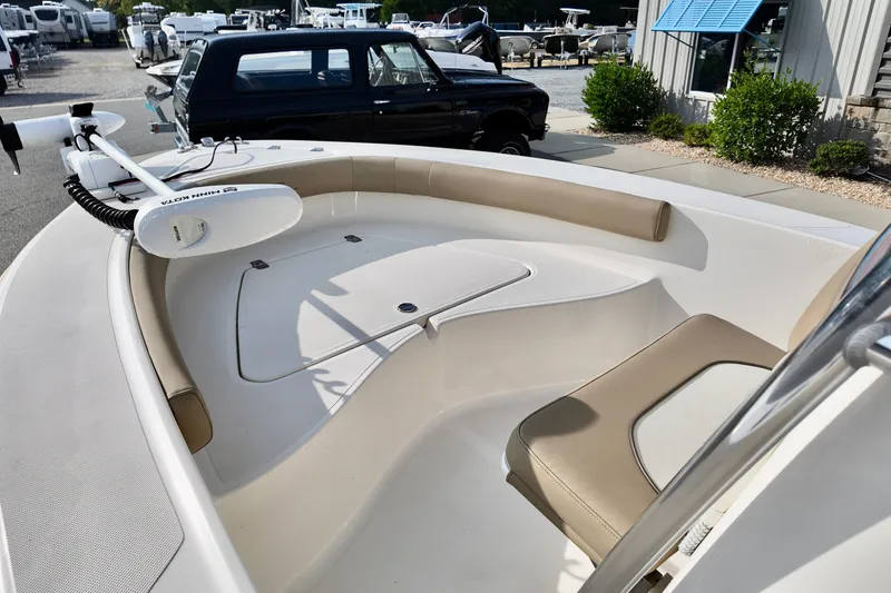 Slide: The Image of 2020 Pioneer 180 Sportfish boat interior with seating and trolling motor. - 10