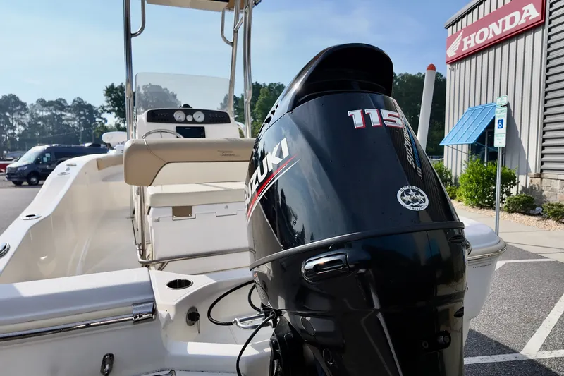 Slide: The Image of 2020 Pioneer 180 Sportfish boat with Suzuki 115 outboard motor at Honda dealership. - 4