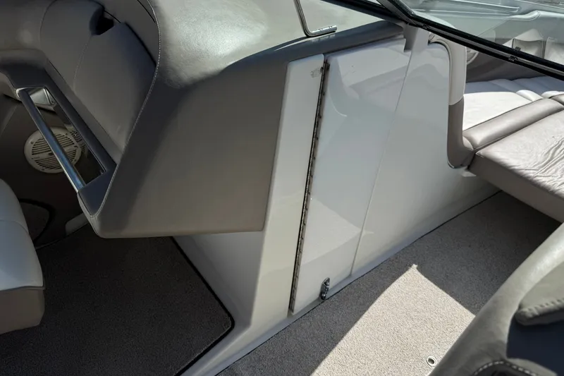Slide: The Image of Interior of a 2001 Cobalt 232 boat, featuring seating and speaker details. - 26