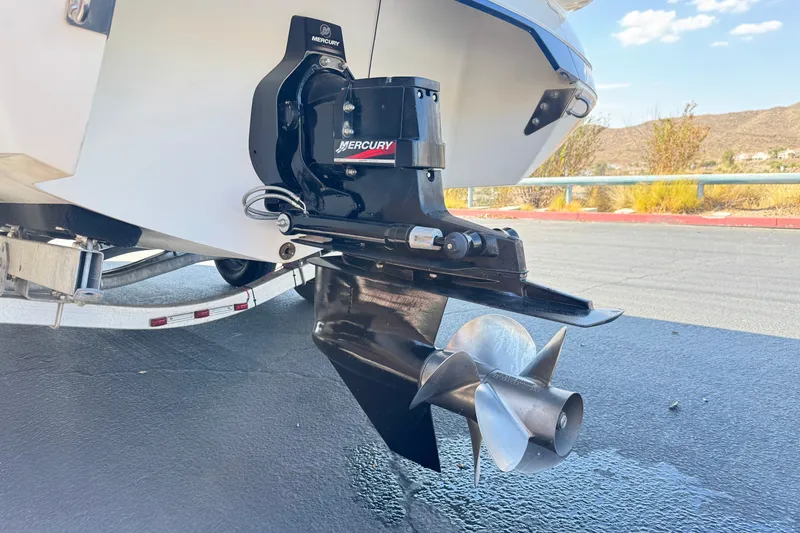 Slide: The Image of Rear view of a 2001 Cobalt 232 boat with Mercury outboard motor. - 7