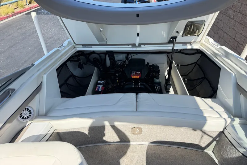 Slide: The Image of Open engine compartment of a 2001 Cobalt 232 boat, showcasing interior components. - 19