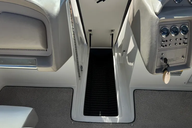 Slide: The Image of Interior of a 2001 Cobalt 232 boat showing seating and control panel. - 27
