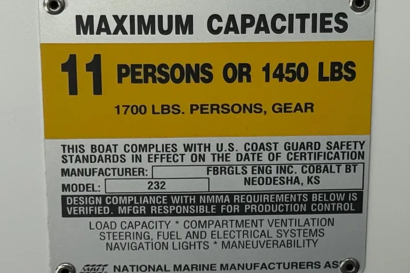 Slide: The Image of 2001 Cobalt 232 boat capacity plate: 11 persons or 1450 lbs, 1700 lbs with gear. - 34