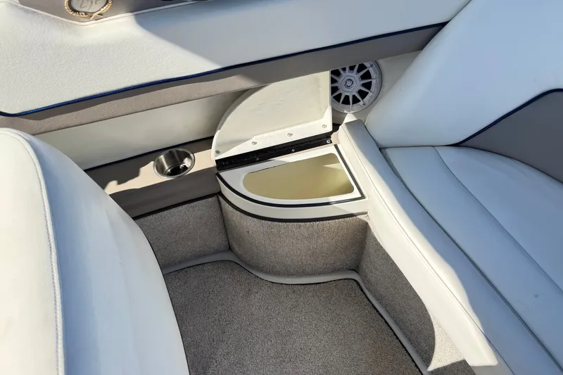 Slide: The Image of Interior of a 2001 Cobalt 232 boat featuring seating and speaker details. - 23