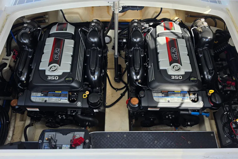 Slide: The Image of Twin 6.2L engines in a 2023 Formula 290 Bowrider boat engine compartment. - 32