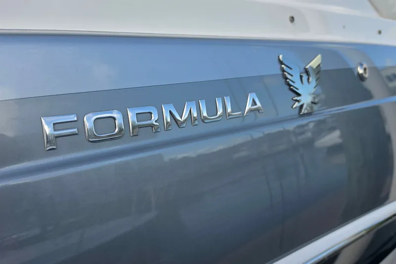 Slide: The Image of 2023 Formula 290 Bowrider logo on sleek blue hull. - 37