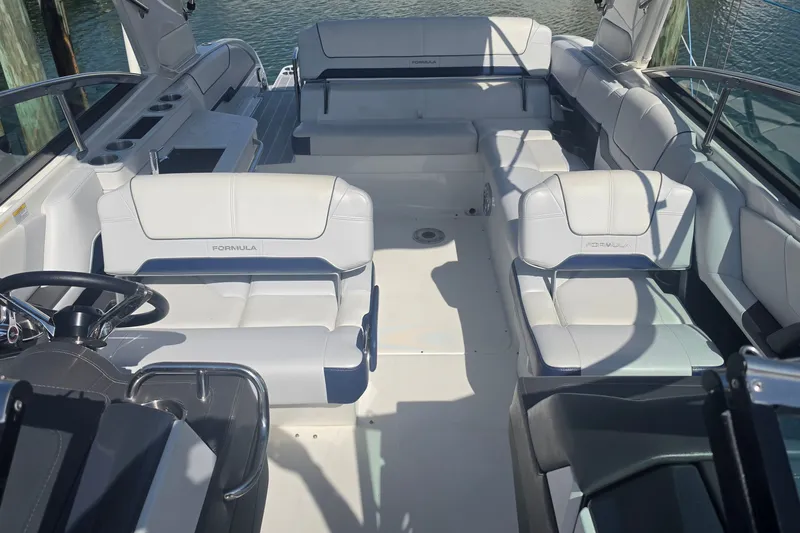 Slide: The Image of 2023 Formula 290 Bowrider interior with luxurious seating and sleek design. - 17