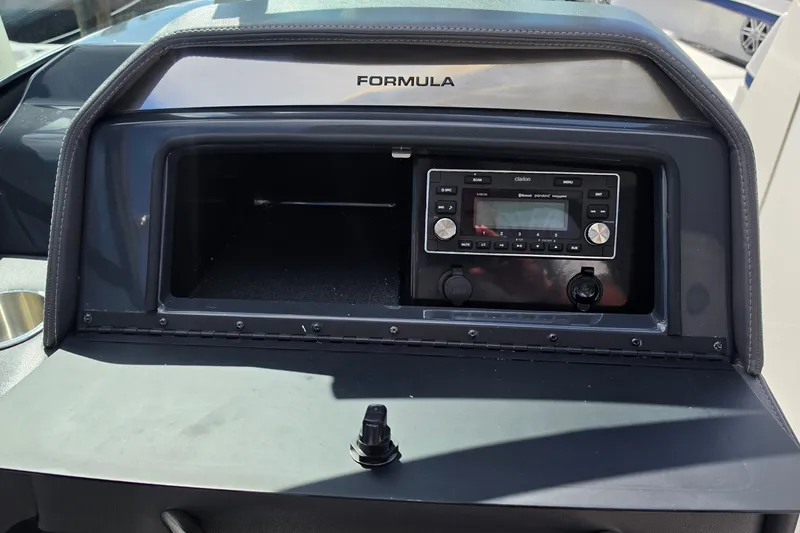 Slide: The Image of Dashboard of 2023 Formula 290 Bowrider with audio system and storage compartment. - 44