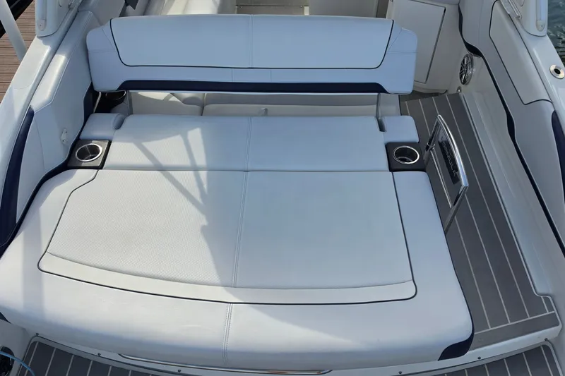 Slide: The Image of 2023 Formula 290 Bowrider boat interior with cushioned seating and cup holders. - 36