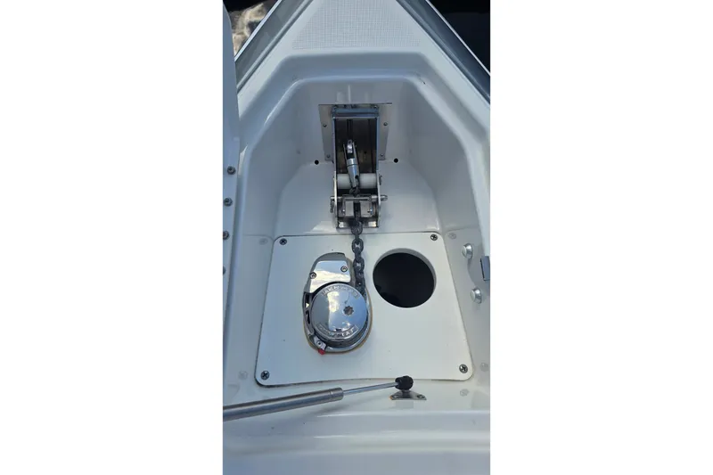 Slide: The Image of Anchor compartment of 2023 Formula 290 Bowrider boat, featuring a polished winch system. - 52