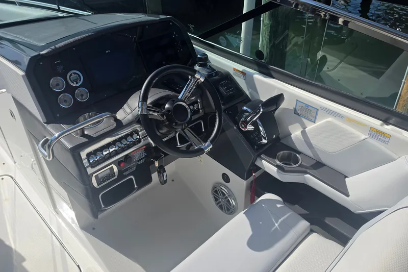 Slide: The Image of 2023 Formula 290 Bowrider cockpit with modern steering wheel and control panel. - 20