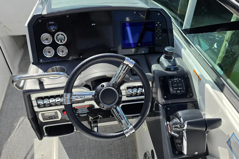 Slide: The Image of 2023 Formula 290 Bowrider dashboard with steering wheel, controls, and digital display. - 22