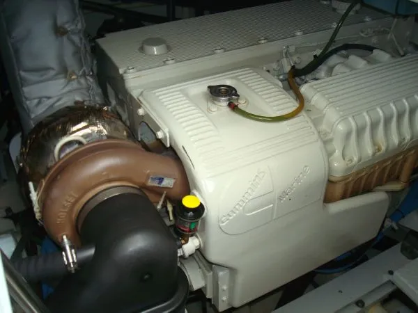 Slide: The Image of Close-up of an engine inside a boat, with visible pipes and components. - 35