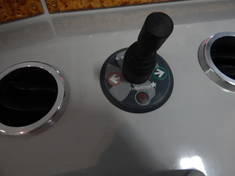 Slide: The Image of Close-up of a joystick on a yacht, surrounded by air vents. - 43