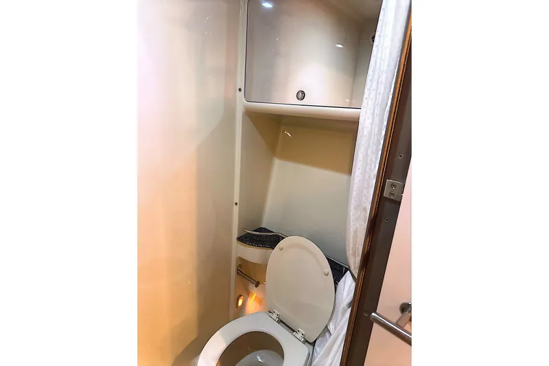 Slide: The Image of 2006 Formula 48 Yacht bathroom interior with toilet and storage cabinet. - 65