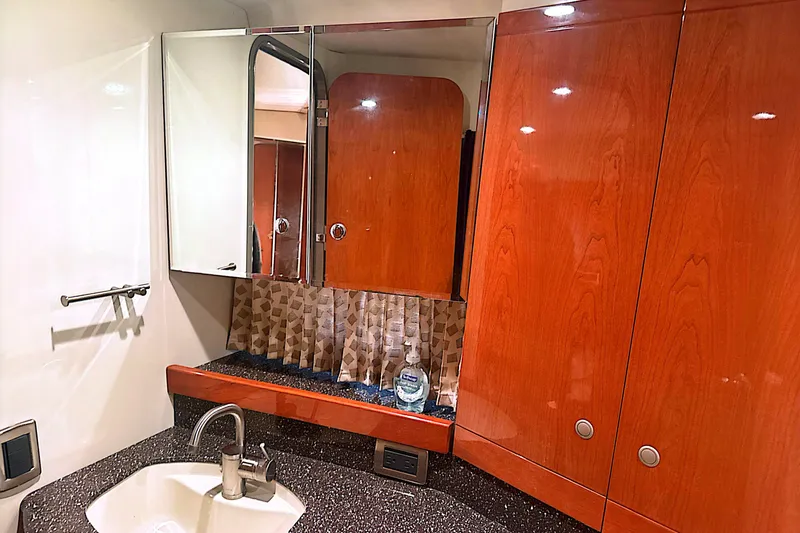Slide: The Image of Luxurious bathroom interior of 2006 Formula 48 Yacht with wooden cabinets and modern fixtures. - 63
