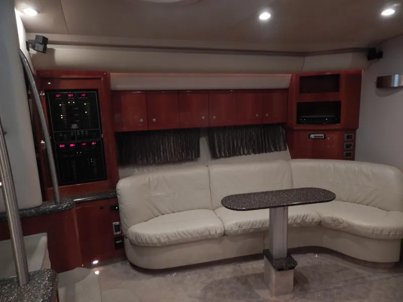 Slide: The Image of Interior of a 2006 Formula 48 Yacht with cream sofa and wooden cabinetry. - 44