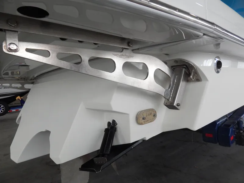 Slide: The Image of Close-up of a yacht's stern with metal brackets and a white hull. - 37