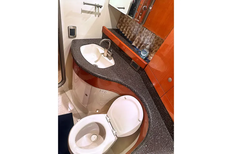 Slide: The Image of Luxurious bathroom in 2006 Formula 48 Yacht with modern sink and toilet. - 64