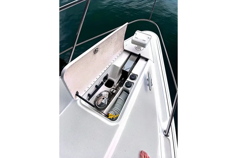 Slide: The Image of Open storage compartment on 2006 Formula 48 Yacht deck, showing equipment and accessories. - 72