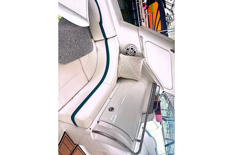 Slide: The Image of Interior view of a 2006 Formula 48 Yacht with white seating and speaker. - 67