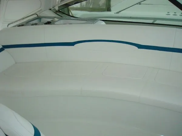 Slide: The Image of Interior of a 2006 Formula 48 Yacht with white upholstery and blue accents. - 17