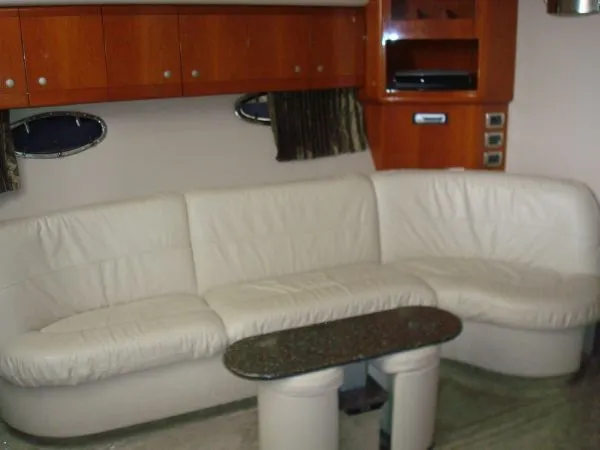 Slide: The Image of Interior of the 2006 Formula 48 Yacht with cream leather sofa and wooden cabinetry. - 27