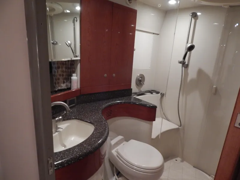 Slide: The Image of Bathroom in a 2006 Formula 48 Yacht with sink, toilet, and shower. - 46