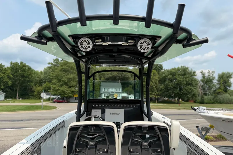 Slide: The Image of 2022 Wellcraft 262 Fisherman boat interior with advanced navigation equipment and sleek design. - 3