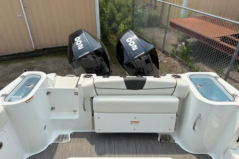 Slide: The Image of 2022 Wellcraft 262 Fisherman boat with dual Mercury engines and seating area. - 27
