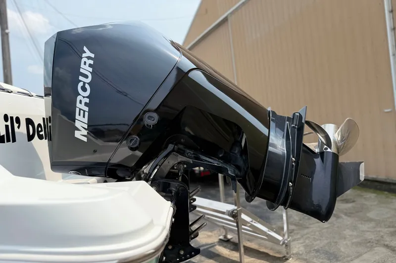 Slide: The Image of Mercury outboard motor on 2022 Wellcraft 262 Fisherman boat, side view. - 32