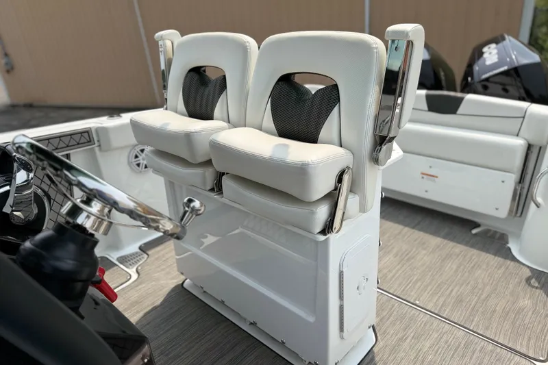 Slide: The Image of 2022 Wellcraft 262 Fisherman boat interior with dual helm seats and steering wheel. - 9