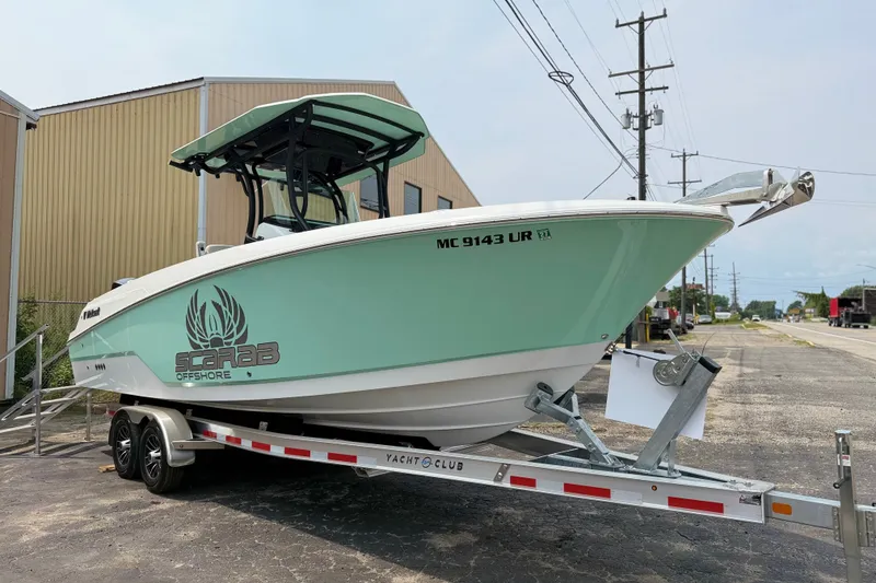 The Image of 2022 Wellcraft 262 Fisherman boat on trailer, mint green hull, Scarab Offshore branding. - 0