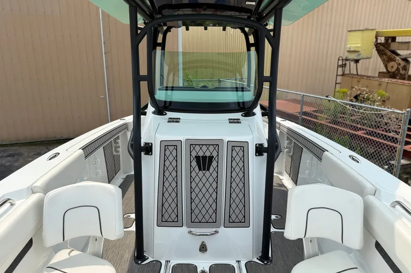 Slide: The Image of 2022 Wellcraft 262 Fisherman boat interior with seating and storage compartments. - 11