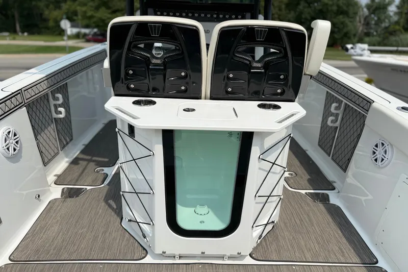 Slide: The Image of 2022 Wellcraft 262 Fisherman boat interior with seating and storage compartments. - 18