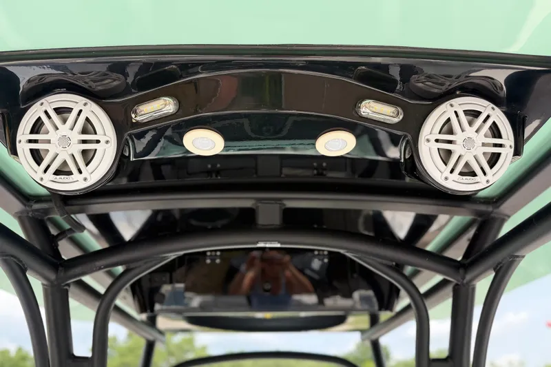 Slide: The Image of 2022 Wellcraft 262 Fisherman boat speakers and lights on black frame. - 4