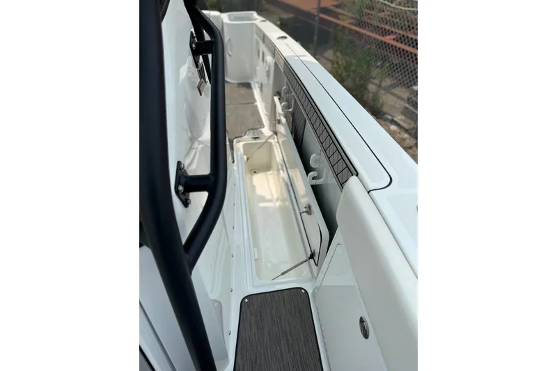 Slide: The Image of 2022 Wellcraft 262 Fisherman boat interior, featuring storage compartments and sleek design. - 20