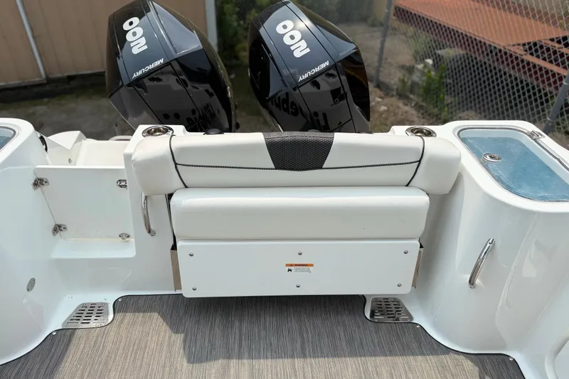 Slide: The Image of 2022 Wellcraft 262 Fisherman boat with dual Mercury engines and seating area. - 26