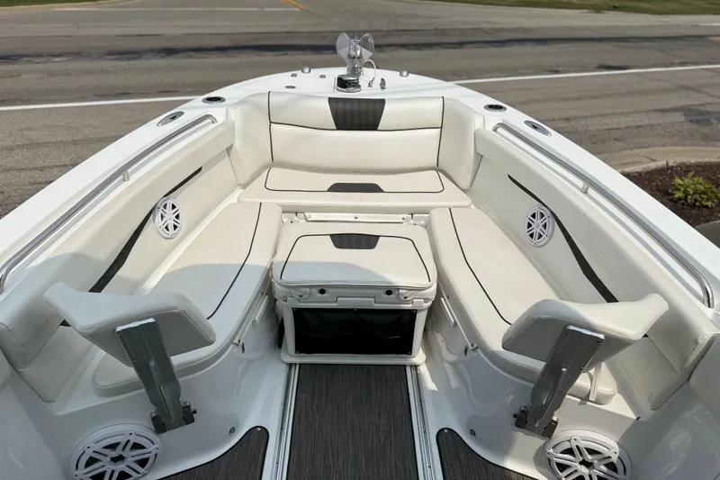 Slide: The Image of 2022 Wellcraft 262 Fisherman boat interior with white seating and modern design. - 8
