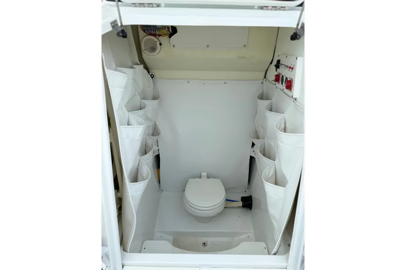 Slide: The Image of Interior of 2022 Wellcraft 262 Fisherman boat with storage and toilet. - 13