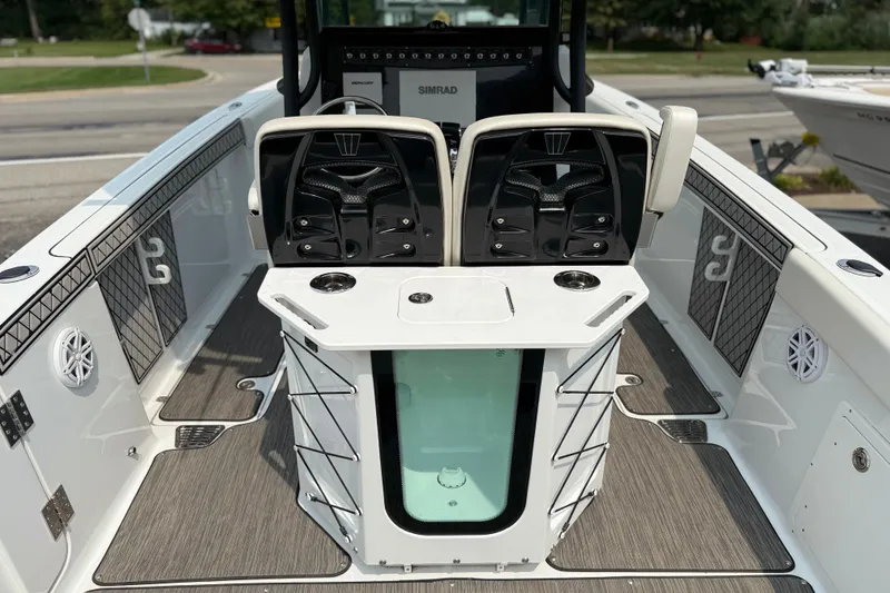 Slide: The Image of 2022 Wellcraft 262 Fisherman boat interior with seating and storage compartments. - 17