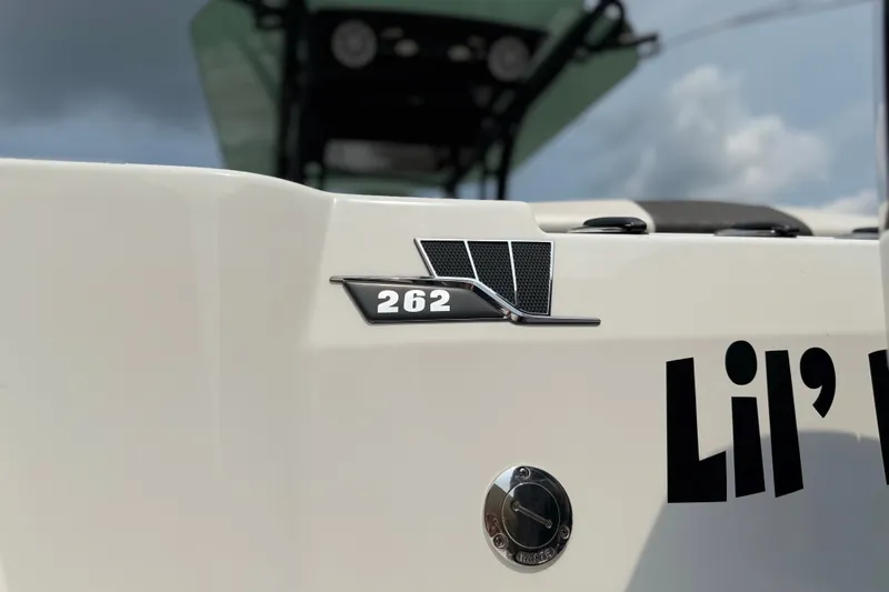 Slide: The Image of 2022 Wellcraft 262 Fisherman boat detail with model emblem and custom name. - 19