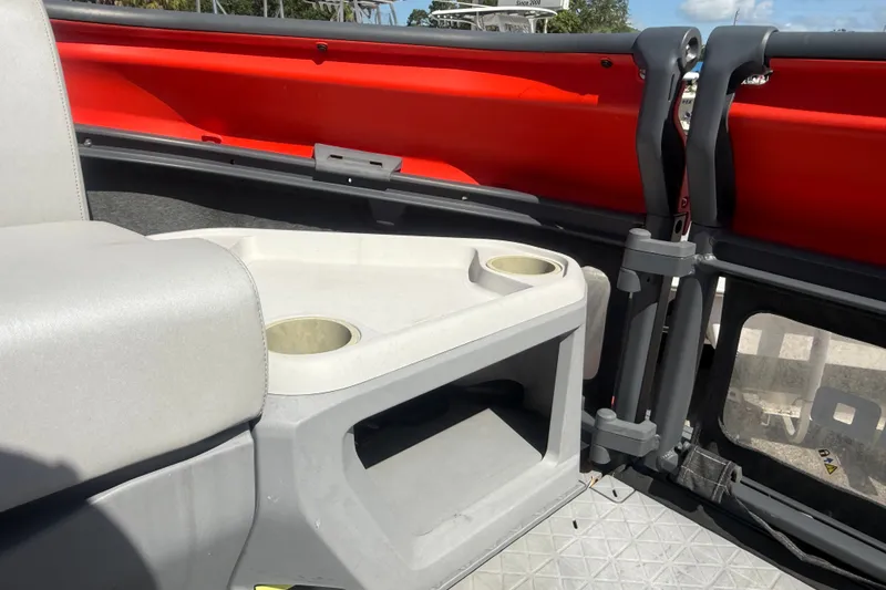Slide: The Image of Interior of 2023 Sea-Doo Switch Cruise 21, featuring seating and cup holders. - 19