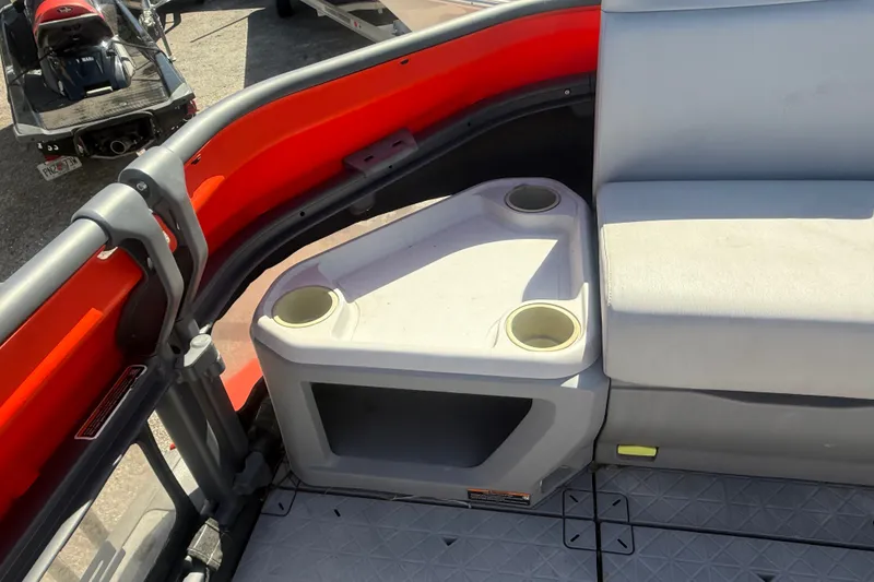 Slide: The Image of Interior of 2023 Sea-Doo Switch Cruise 21 with seating and cup holders. - 18