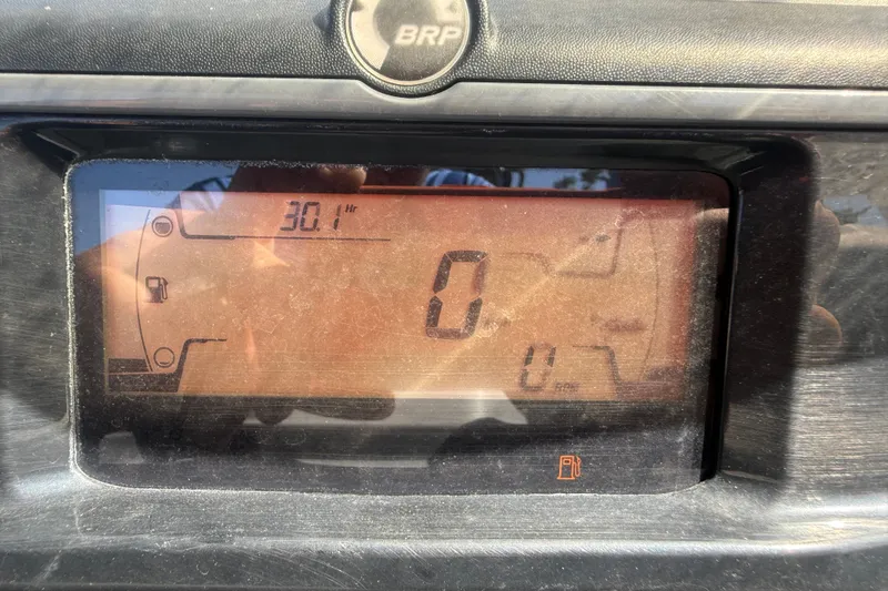 Slide: The Image of Dashboard display of 2023 Sea-Doo Switch Cruise 21 showing 30.1 hours and fuel gauge. - 14