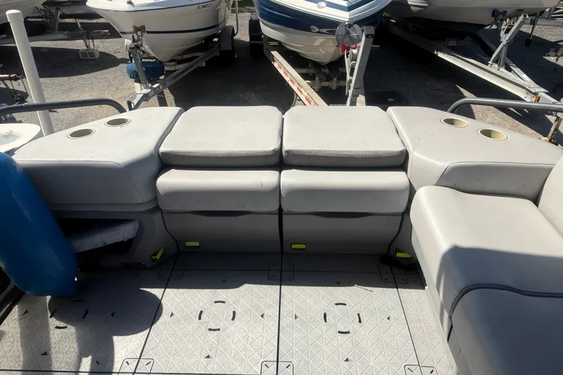Slide: The Image of 2023 Sea-Doo Switch Cruise 21 interior seating with cup holders and storage. - 11