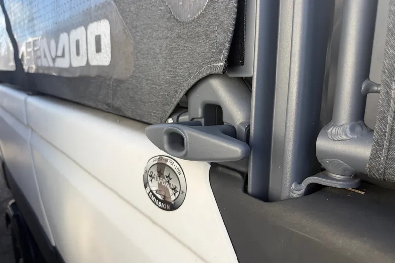 Slide: The Image of Close-up of 2023 Sea-Doo Switch Cruise 21 boat detail with ultra-low emission badge. - 9