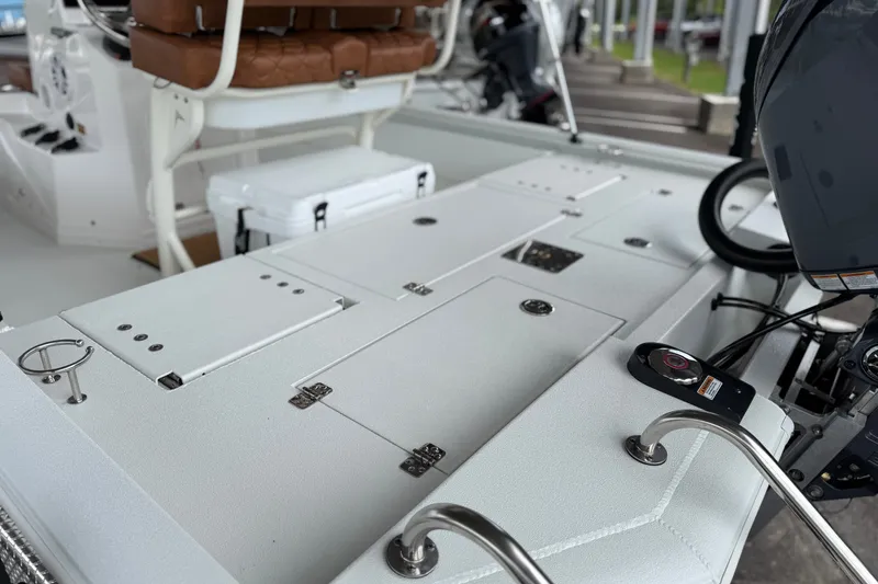 Slide: The Image of Interior view of 2027 Avid 21 Fusion boat, featuring seating and control panel. - 16
