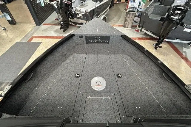 Slide: The Image of 2027 Lund 1800 Adventure Sport boat interior with storage compartments and modern design. - 8