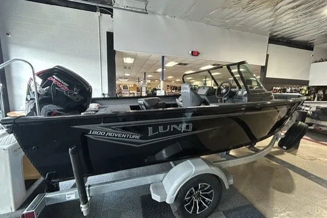 Slide: The Image of 2027 Lund 1800 Adventure Sport boat on trailer in showroom. - 4